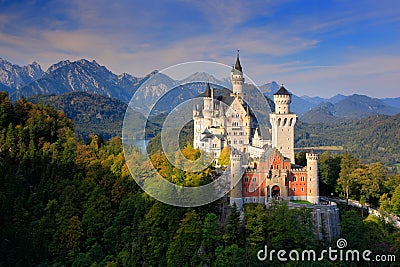 Famous fairy tale Neuschwanstein Castle in Bavaria, Germany, late afternoon with blue sky with white clouds Stock Photo