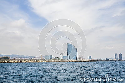 Famous five-star W Barcelona Hotel (Hotel Vela - Sail) located in the Barceloneta district, of the Port of Barcelona Editorial Stock Photo