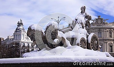 The famous Fountain of Cybele in Madrid, snowcovered after Filomena snowstorm Editorial Stock Photo