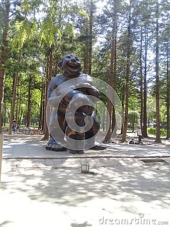 Famous Gigantic statue of a mother breastfeeding her child on a sunny day Editorial Stock Photo