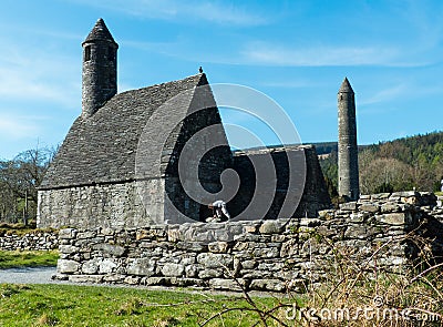 The famous Glendalough Monastic site with its round tower and cemetery in the Wicklow mountains in County Wicklow, Editorial Stock Photo