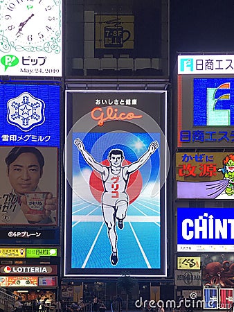 Famous glico man billboard at Osaka city night Editorial Stock Photo