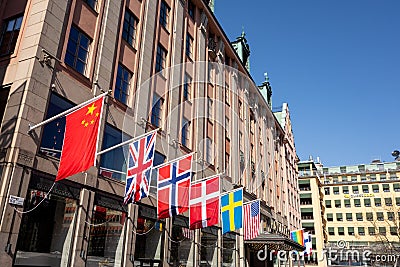 The famous Haymarket hotel in the centre of Stockholm, Sweden at Hotorget street with a lot of countries flags Editorial Stock Photo