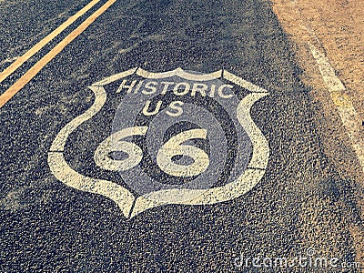 Famous historic us route 66 road asphalt sign covered with desert sand Stock Photo