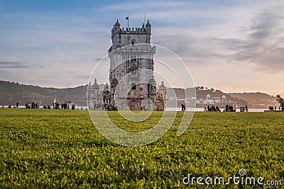 BelÃ©m, Lisbon PORTUGAL - 9 February 2020 - Groups of people strolling by the BelÃ©m Tower, one of the most famous monuments in th Editorial Stock Photo