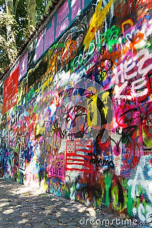 Famous John Lennon Wall covered with graffiti in Little Town near Charles Bridge, Mala Strana, Prague, Czech Republic Editorial Stock Photo
