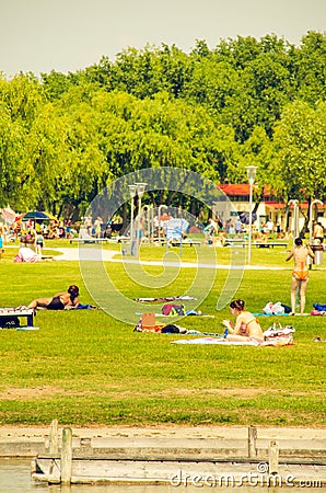 The famous Lake Neusiedl,Burgenland, sunbathing on grassy shore Editorial Stock Photo