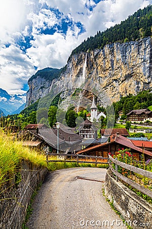 Famous Lauterbrunnen town and Staubbach waterfall, Bernese Oberland, Switzerland, Europe. Lauterbrunnen valley, Village of Stock Photo