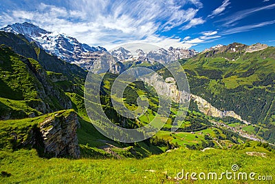 Famous Lauterbrunnen valley with gorgeous waterfall and Swiss Alps Stock Photo