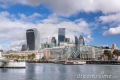 London with modern city architecture against river with boats in England, UK Stock Photo