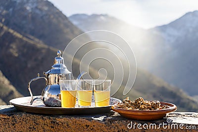 Famous Moroccan mint tea and silver kettle in High Atlas mountains Stock Photo