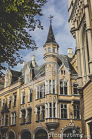 Famous narrow medieval architecture building street with church Stock Photo