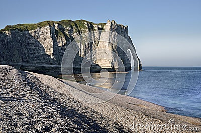Pebble beach and cliff of Etretat in France Stock Photo