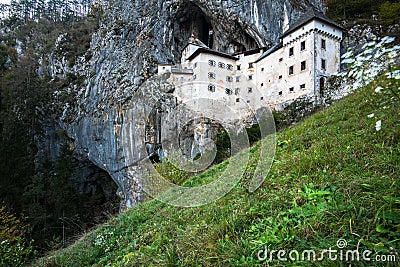 Famous Predjama castle in the mountain, build inside the rock, Slovenia Stock Photo