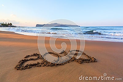 Famous resort of Crete island, Greece. Sand beach seascape with the rays of the sun. 2019 writing on the surface. Beautiful sea Stock Photo