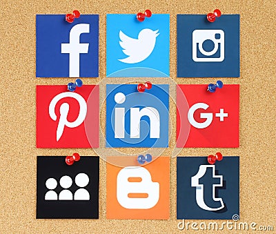 Famous social media pinned on cork bulletin board Editorial Stock Photo