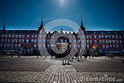 Famous square in Madrid.Plaza Mayor with surrounding red buildings.Visiting landmarks and places.Marid,Spain travel Editorial Stock Photo