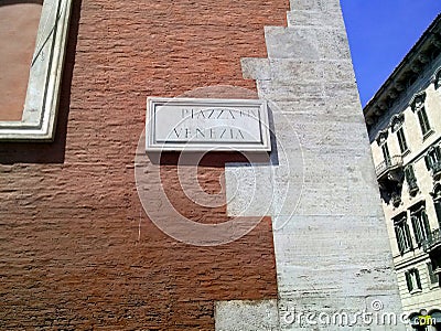 Piazza Venezia sign on brick wall, Rome, Italy. Stock Photo