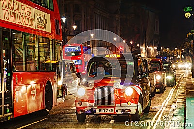 Famous taxi cab on a street in London Editorial Stock Photo