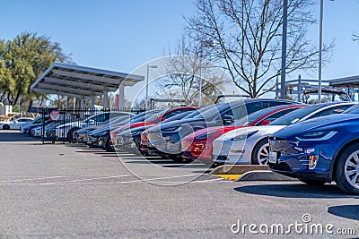 Famous Tesla cars lined up outdoors at a Tesla dealership on a sunny day in Rocklin Editorial Stock Photo