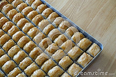 Famous Turkish baklava dessert sliced in a baking tray, Gaziantep baklava Stock Photo