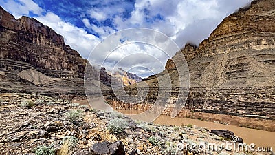 The famous west gate of the Grand Canyon of the Colorado crossing the famous river through its gorge on the border of the states Stock Photo