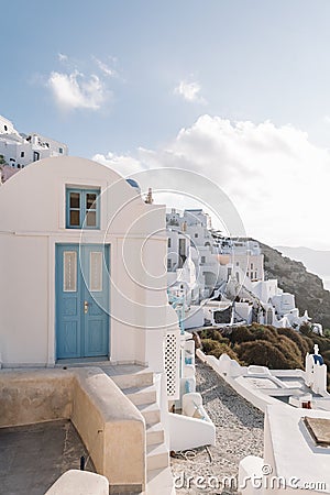 Famous white buildings on street in Santorini, Greece Stock Photo