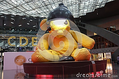 The famous yellow Teddy Bear of Hamad International Airport,Doha Editorial Stock Photo