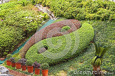 Famous Yin Yang Symbol on lawn in Garden of Fortune,Wong Tai Sin Taoist Temple Stock Photo