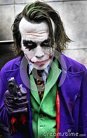 A fan of comics disguised as the Joker Editorial Stock Photo