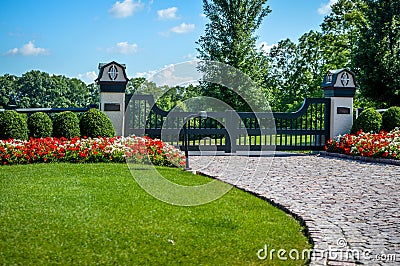 Fancy Gated Entrance Brick Driveway Stock Photo