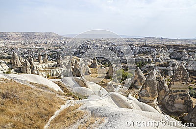 Fancy geological mountain formations with dovecotes of the Pigeon valley in Goreme, Cappadocia, Turkey Stock Photo