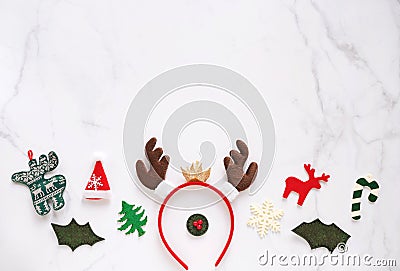 Fancy headband with reindeer antler and decorative christmas for party and celebration on white marble background Stock Photo