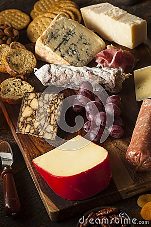 Fancy Meat and Cheeseboard with Fruit Stock Photo