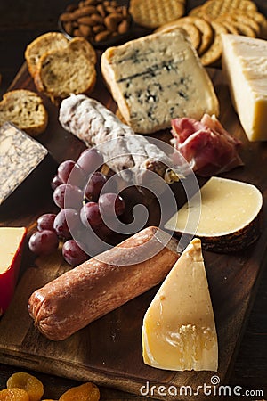 Fancy Meat and Cheeseboard with Fruit Stock Photo