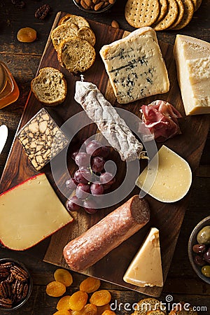 Fancy Meat and Cheeseboard with Fruit Stock Photo