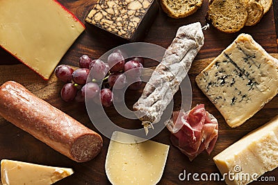 Fancy Meat and Cheeseboard with Fruit Stock Photo