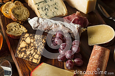 Fancy Meat and Cheeseboard with Fruit Stock Photo