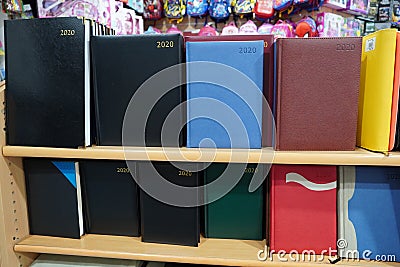 Fancy Notebooks, diaries for arranged sale at a shop. Nice organizer books for your planning. New year 2020 colorful diary on sale Editorial Stock Photo
