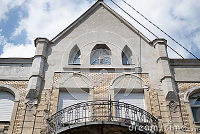 Fancy old designed symmetrical building with an elegant balcony Stock Photo