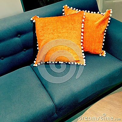 Fancy orange cushions decorating a sofa Stock Photo