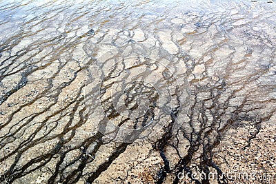 Fancy patterns on the bottom of the basin of the geyser in the Yellowstone national park Stock Photo