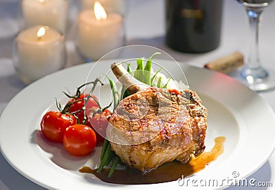 Fancy pork chop and candles Stock Photo