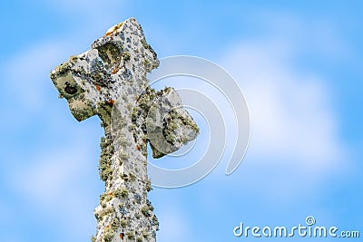 Fancy Stone Cross Covered With Moss Stock Photo