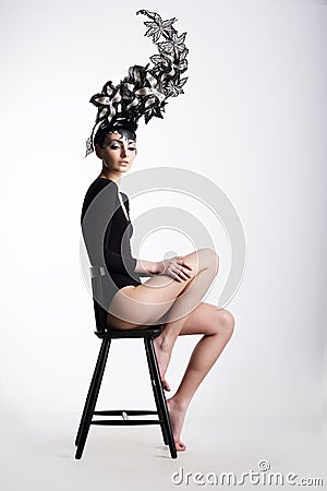Fancy Woman in Surreal Metallic Headwear Stock Photo