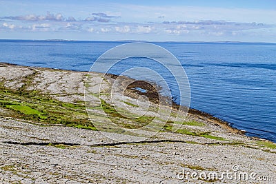 Fanore beach in Burren mountain with Aran Islands in background Stock Photo