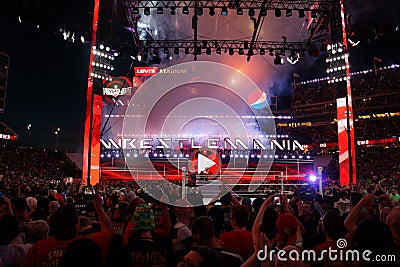 Fans cheer and record action on phones at close of Wrestlemania Editorial Stock Photo