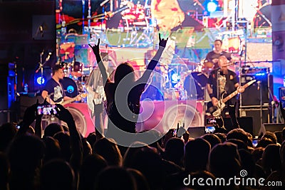 Fans at live rock music concert cheering Editorial Stock Photo