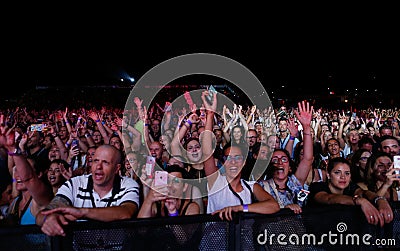 Fans during Spanish singer Manu Carrasco show in Mallorca Editorial Stock Photo