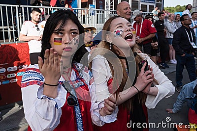 Fans are watching the football match Germany Korea Editorial Stock Photo